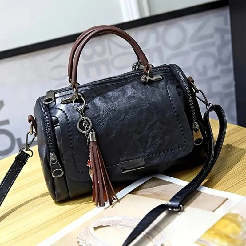 Textured Faux Leather Satchel Bag with Tassel Charm and Metal Latch